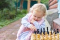 child prodigy plays chess. The concept of development, training, education Royalty Free Stock Photo