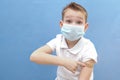 a child in a protective mask was given a vaccine against the disease, coronavirus or covid-19 Royalty Free Stock Photo