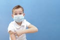 a child in a protective mask was given a vaccine against the disease, coronavirus or covid-19 Royalty Free Stock Photo