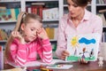 Child psychologist discusses drawing a little girl Royalty Free Stock Photo