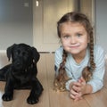 Child and puppy are happy. Animal care concept Royalty Free Stock Photo