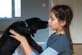 Child and puppy kiss. Dog man`s best friend Royalty Free Stock Photo