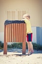 Child putting waste in the bin Royalty Free Stock Photo