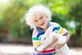 Child with rabbit. Easter bunny. Kids and pets. Royalty Free Stock Photo