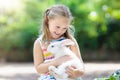 Child with rabbit. Easter bunny. Kids and pets. Royalty Free Stock Photo