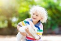 Child with rabbit. Easter bunny. Kids and pets Royalty Free Stock Photo