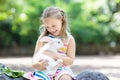 Child with rabbit. Easter bunny. Kids and pets. Royalty Free Stock Photo