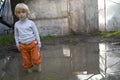 Child in rain soaked with water.