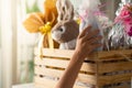 Child reaching white easter egg in wooden basket at home Royalty Free Stock Photo