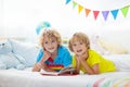 Child reading in bed. Kids read. Boy at home Royalty Free Stock Photo