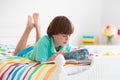 Child reading in bed. Kids read. Boy at home Royalty Free Stock Photo