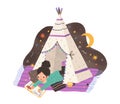 Child reading book in homemade teepee. Girl with storybook in home tent or hut. Kid resting on blanket and cushions in