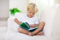 Child reading book. Kids read books