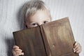 Child reading old book Royalty Free Stock Photo