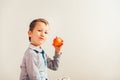 Child ready to eat an apple at a bite, isolated on white background with copy space Royalty Free Stock Photo