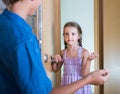 Child receiving expected friend at home interior