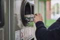 Child recycling plastic bottles in a machine Royalty Free Stock Photo