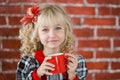 Child with red cup of hot cocoa or chocolate with marshmallow Royalty Free Stock Photo