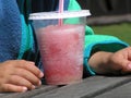 Child with red slush ice