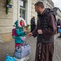 Refugee an monk at Przemysl train station near the Ukraine border with Poland