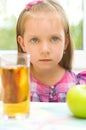 Child refuses to drink apple juice Royalty Free Stock Photo