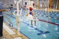 Child rehabilitation session in the swimming pool Royalty Free Stock Photo