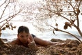 Child relaxing on beach of Azov sea Royalty Free Stock Photo