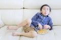 Child relaxing on the sofa with funny expression Royalty Free Stock Photo