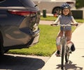 child ride bicycle at dangerous car. dangerous road rules for child. With cautious excitement. safety road education Royalty Free Stock Photo