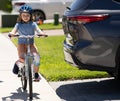 child ride bicycle at dangerous car. dangerous road rules for child. With cautious excitement. safety road education Royalty Free Stock Photo