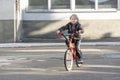 Child rides Bicycle on paved road. Boy learns to ride bike