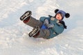 Child rides on an ice-boat from a snow slide