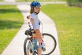 Child riding bicycle. Little kid boy in helmet on bicycle along bikeway. Happy cute little boy riding bicycle. Child in Royalty Free Stock Photo