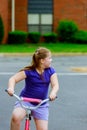 Child riding bike. Kid on bicycle in sunny park. Little girl enjoying bike ride on her way to school on warm summer day. Royalty Free Stock Photo