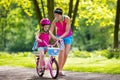 Mother teaching child to ride a bike Royalty Free Stock Photo