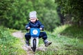 Child riding bike through a puddle creating a splash Royalty Free Stock Photo