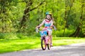 Child on bike. Kids ride bicycle. Girl cycling. Royalty Free Stock Photo