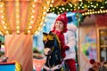 Child riding carousel on Christmas market Royalty Free Stock Photo
