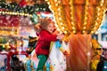 Child riding carousel on Christmas market Royalty Free Stock Photo