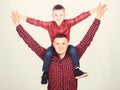 Child riding on dads shoulders. Happiness being father of boy. Having fun. Fathers day. Father example of noble human Royalty Free Stock Photo