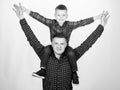 Child riding on dads shoulders. Happiness being father of boy. Having fun. Fathers day. Father example of noble human Royalty Free Stock Photo