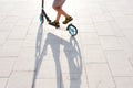 Child riding a scooter Royalty Free Stock Photo