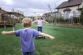 Child riding on self-balancing hover board on the backyard of cottage, outdoor kids activity