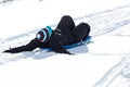 Child riding a sled bundled in warm clothing