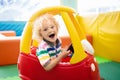 Child riding toy car. Little boy with toys. Royalty Free Stock Photo