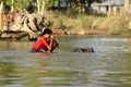 Child riding a water buffalo in Inle Lake