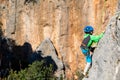 Child rock climber. The boy climbs the rock. The child is engaged in rock climbing on natural terrain. Sports kid spends time Royalty Free Stock Photo