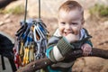 Child of rock climbers smiling while standing Royalty Free Stock Photo