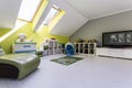 Child room at the attic with TV set Royalty Free Stock Photo