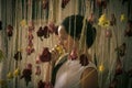 Child with roses in florist shop, floristry